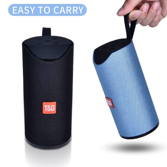 Portable waterproof Bluetooth speaker with attached carabiner and mesh exterior"
